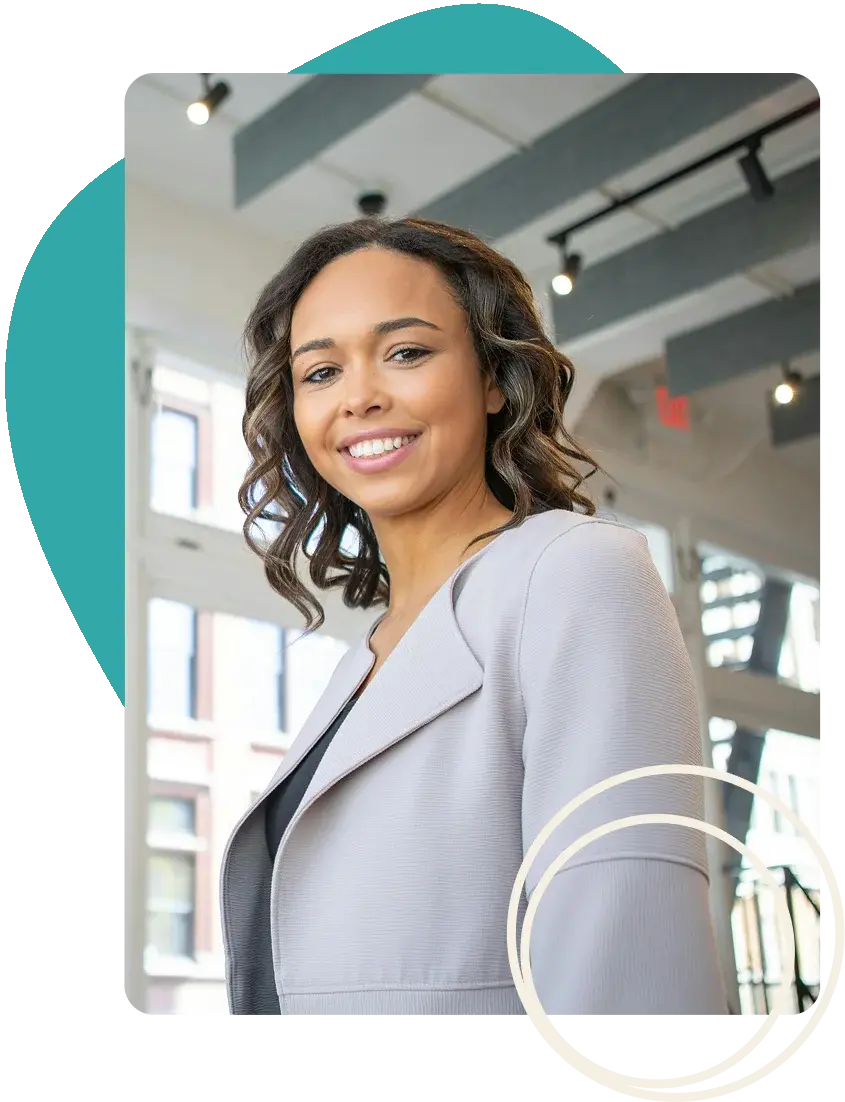 A confident leader smiling in a modern office environment. A confident leader smiling in a modern office environment.